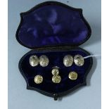 A late Victorian 9ct gold dress stud and cufflink's set, each with impressed floral motifs,