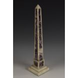 A Grand Tour type amethyst quartz library obelisk, stepped square base, 38.