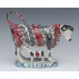 A 19th century Pearlware cow creamer, possibly Yorkshire, standing four square,