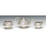 A George IV Irish silver three piece compressed ogee tea service, comprising teapot,