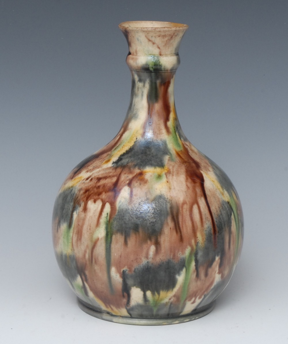 A Whieldon-type guglet or bottle vase, typically glazed in mottled earthy tones, 22cm high,