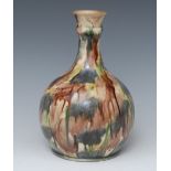 A Whieldon-type guglet or bottle vase, typically glazed in mottled earthy tones, 22cm high,