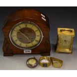 A silver pocket watch; an oak mantel clock; a brass carriage clock;