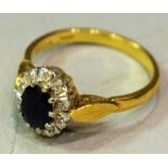 An 18ct gold diamond and sapphire ring