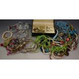 A quantity of costume jewellery, including bead necklaces, white metal chains, bracelets,
