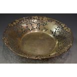 A silver bowl, pierced with vines and grapes on three paw feet, Sheffield,