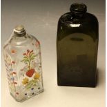 An 18th century green glass sealed spirit bottle of squat form;