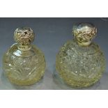 A Victorian silver topped cut glass scent bottle, Birmingham 1899; another,