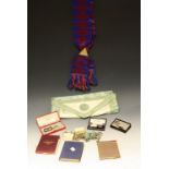 Masonic Interest - a 9ct gold Masonic jewel, boxed; a silver badge; apron,