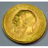 A George V gold sovereign,