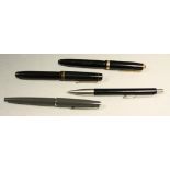 A Parker Duofold fountain pen; three others,