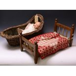 A Victorian wicker doll's crib; an early 20th century scratch built oak doll's bed;