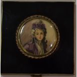 A French enamelled compact with portrait of elegant lady painted on ivorine