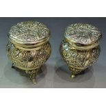 A near pair of Asian white metal jars and covers, 10.