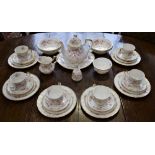 A Paragon Victoriana Rose pattern tea and dessert service, for six, comprising teapot, cups,