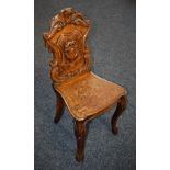 A Victorian oak hall chair,