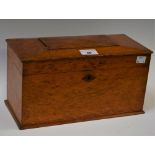 An oak rectangular tea caddy, the hinged top enclosing three compartments,