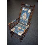 An early 20th century American spring rocking chair,