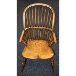 A Country House Windsor elbow chair, bowed cresting rail above a conforming mid rail,