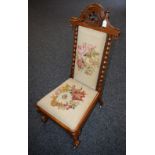 A Victorian Gothic Revival walnut nursing chair,