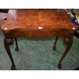 A George II style burr walnut and mahogany serpentine card table,