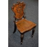 A Victorian oak hall chair,