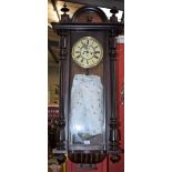 A 19th century chimney wall clock, cream dial, Roman numerals, double weight movement, arched top,