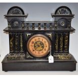 A large Victorian mantel clock, circular dial with Arabic numerals, minute track,