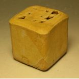 A salt glazed stoneware cube vase, by Eileen Lowenstein, of folded form, glazed throughout in ochre,