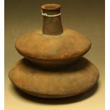 A stoneware double gourd bottle vase, in the manner of Hans Coper, slip glazed in brown,