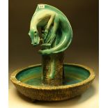 A large ceramic dragon water feature, turquoise glaze, approx 58cm diameter,
