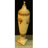 An Egyptian style amphora shaped floor standing lamp, of large proportions, rams head bosses,
