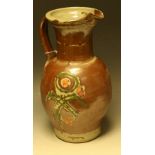 A large stoneware jug, by Stanislas Reychan, salt glazed in shades of brown, pink and green,