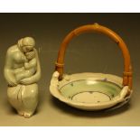 A stoneware Japanese inspired studio pottery basket, bamboo loop handle,