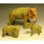 A set of three Royal Dux elephants, in typical palette, 15cm high and 9cm high, c.