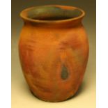 An earthenware ovoid raku vase, attributed to Willie Carter, in typical matt rainbow tones,