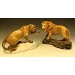 A Beswick model, Puma on a Rock, matte, 21cm high, printed mark, model no 1702; another, Lion,