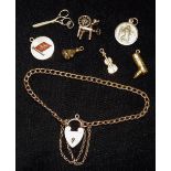 9ct gold bracelet and charms inc spinning wheel, scissors, etc (14.