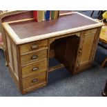 A Pitch Pine kneehole desk, leather inlaid top,