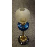 A Victorian oil lamp with clear glass shade,