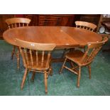 A Parker Knoll trestle type extending dining table;