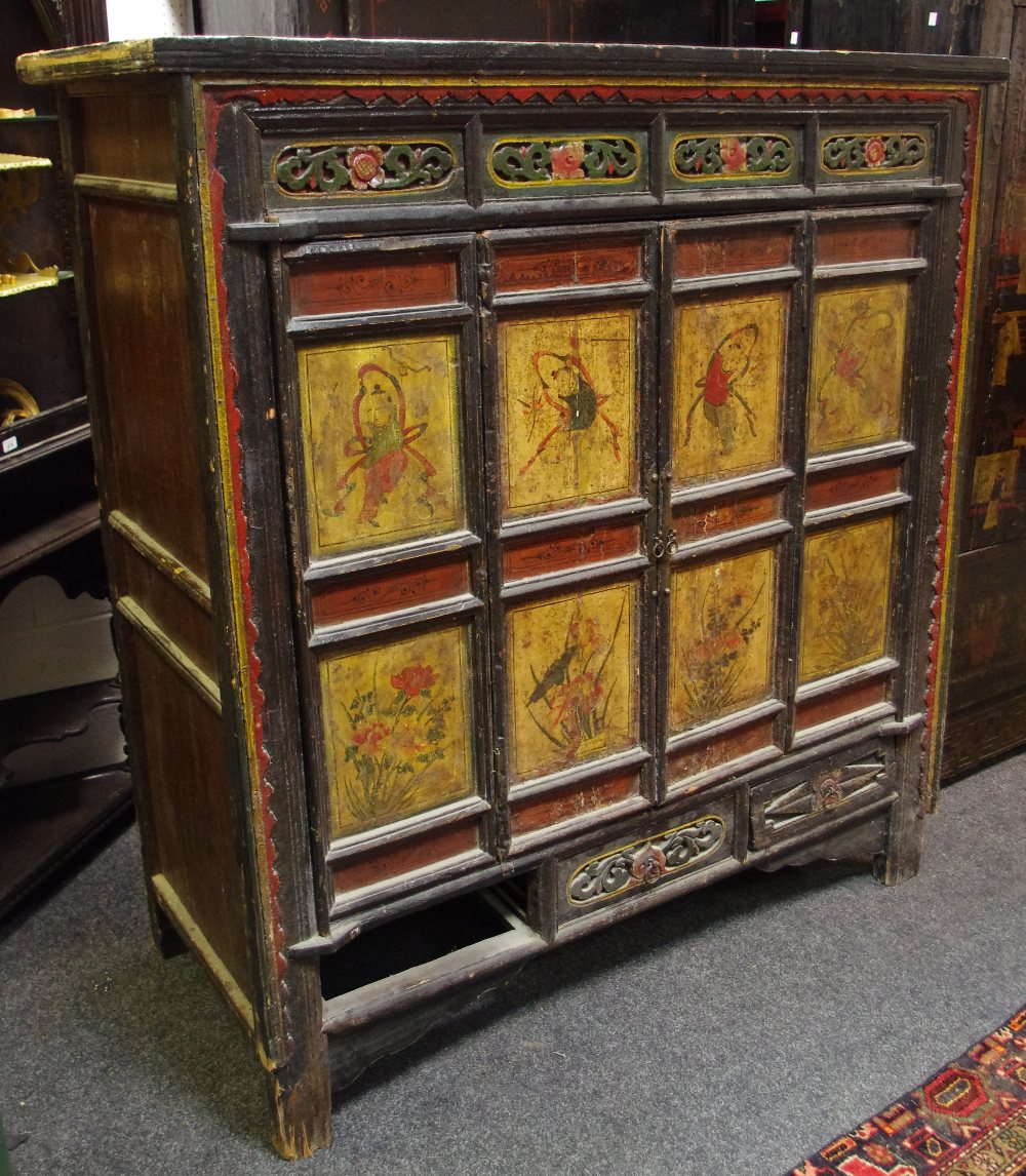 An oriental wardrobe, two bi-fold panel doors, the panels depicting dancers and flowering plants,