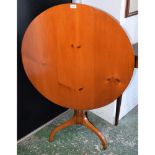 A George III design occasional table, circular tilting pine top,