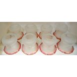 Eight cranberry and frosted light shades decorated with Neo Classical swags