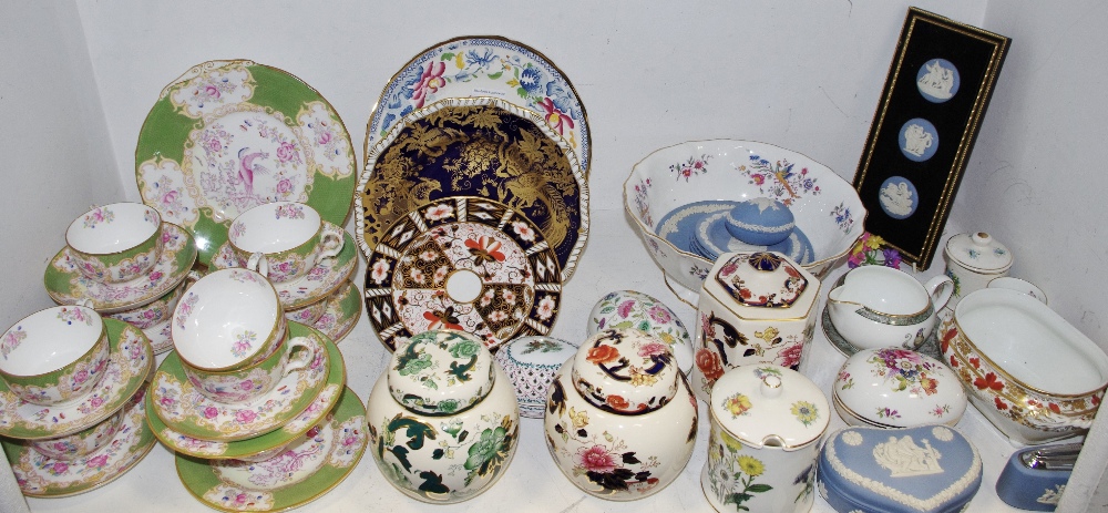 A set of six Minton Cockatrice pattern teacups & saucers;