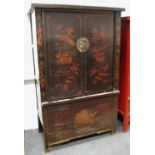 An oriental wardrobe decorated with scenes of fruit and flora