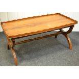 A contemporary yew wood coffee table