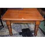 A Victorian mahogany wind out canted rectangular dining table, boldly turned supports, c.