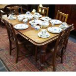 A Victorian mahogany extending dining table (one leaf); three Hepplewhite style oak dining chairs,
