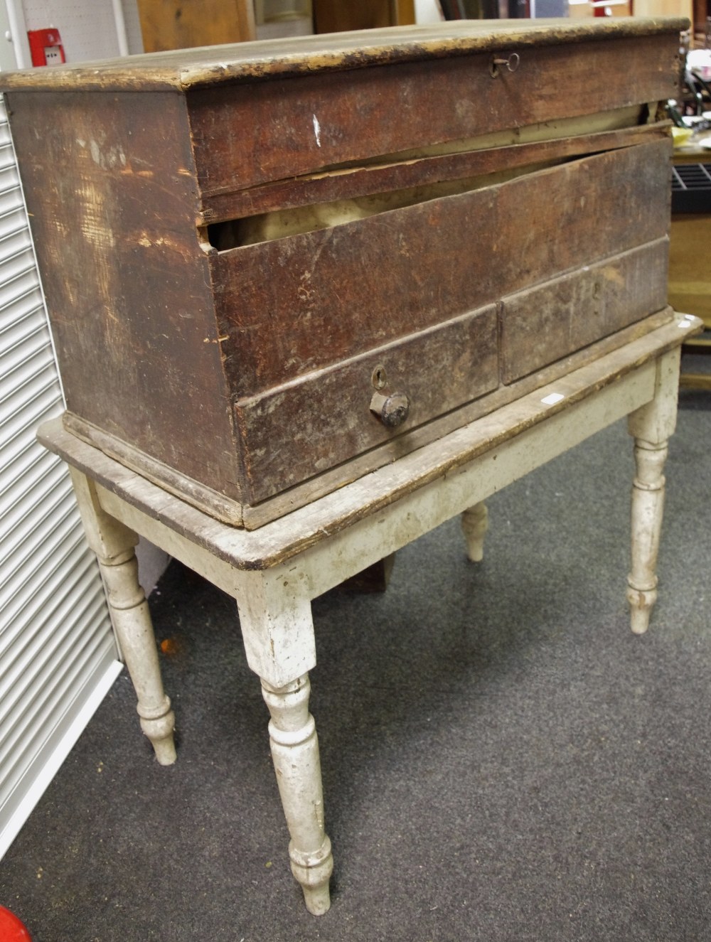 A rustic Victorian painted pine kitchen table; a Victorian stained pine mule chest;